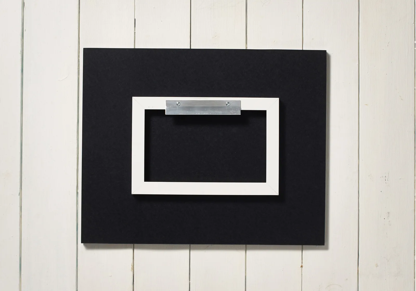 Back of the panel with its hidden hanging rail